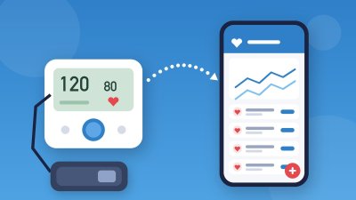 Aparelho de pressão ao lado do celular com app que registra as medições